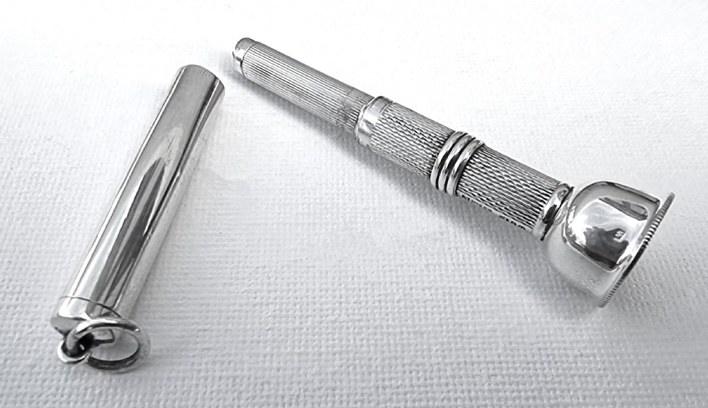 A rare silver cigar punch/cutter, Birmingham 1954/55 View V