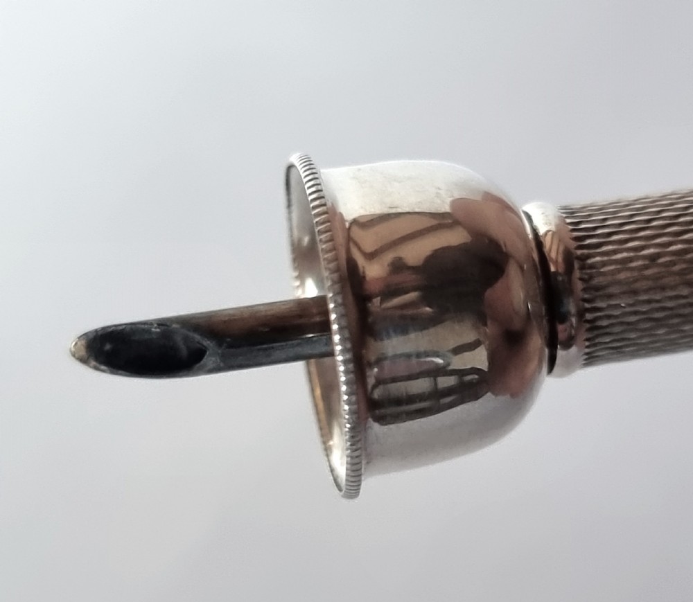 A rare silver cigar punch/cutter, Birmingham 1954/55 View X