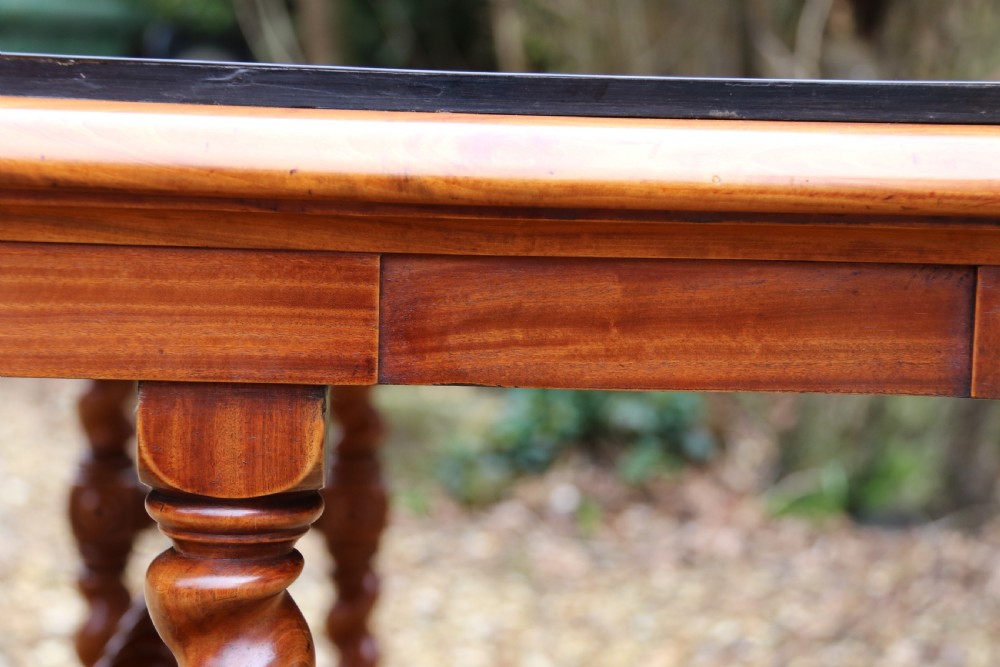 A rectangular mid-19th century satinwood centre table featuring detailed floral marquetry inlay across the tabletop, supported by carved barley twist legs and a central stretcher. View X