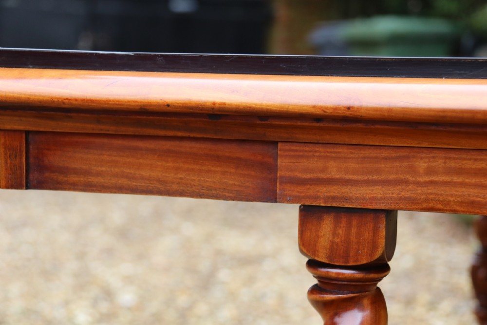 A rectangular mid-19th century satinwood centre table featuring detailed floral marquetry inlay across the tabletop, supported by carved barley twist legs and a central stretcher. View XXIV