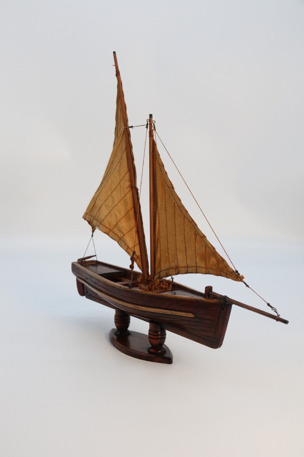 An English handmade yew wood model of an elegant 19th century sailing boat. View IV