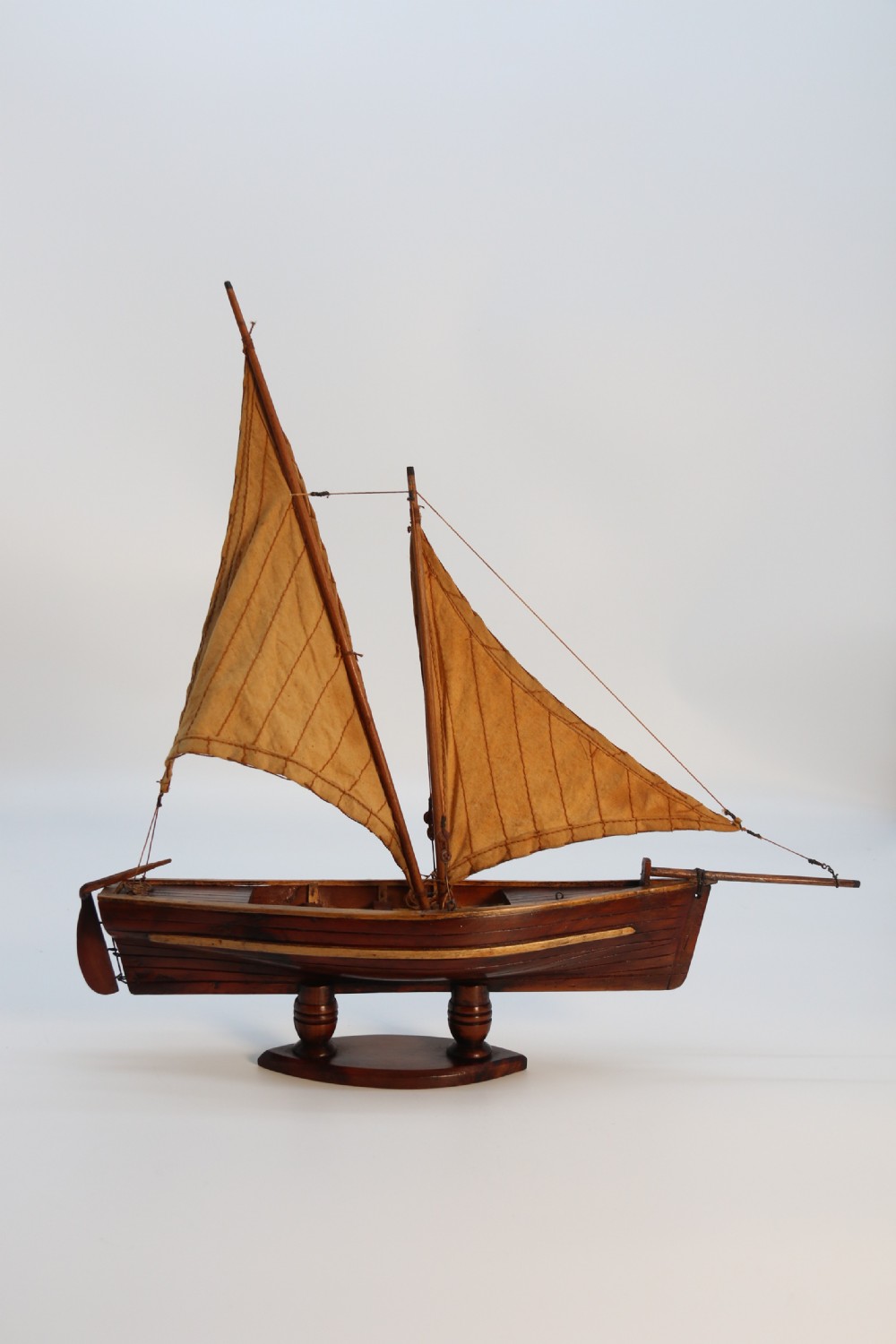 An English handmade yew wood model of an elegant 19th century sailing boat. View V