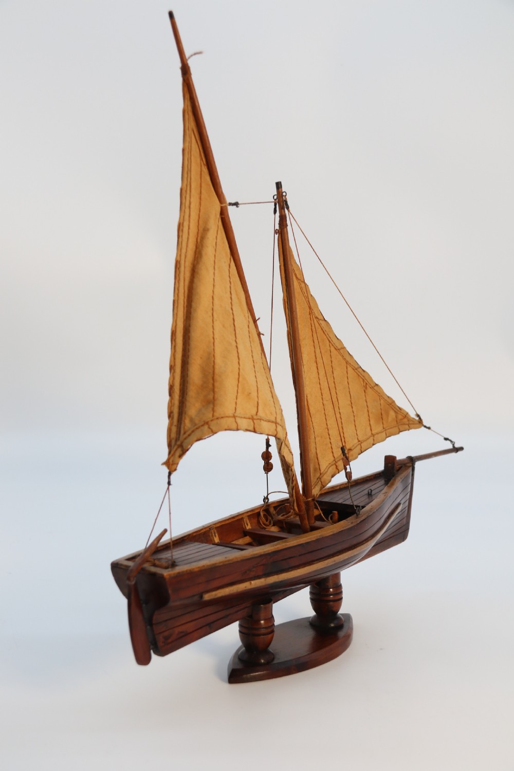 An English handmade yew wood model of an elegant 19th century sailing boat. View VI