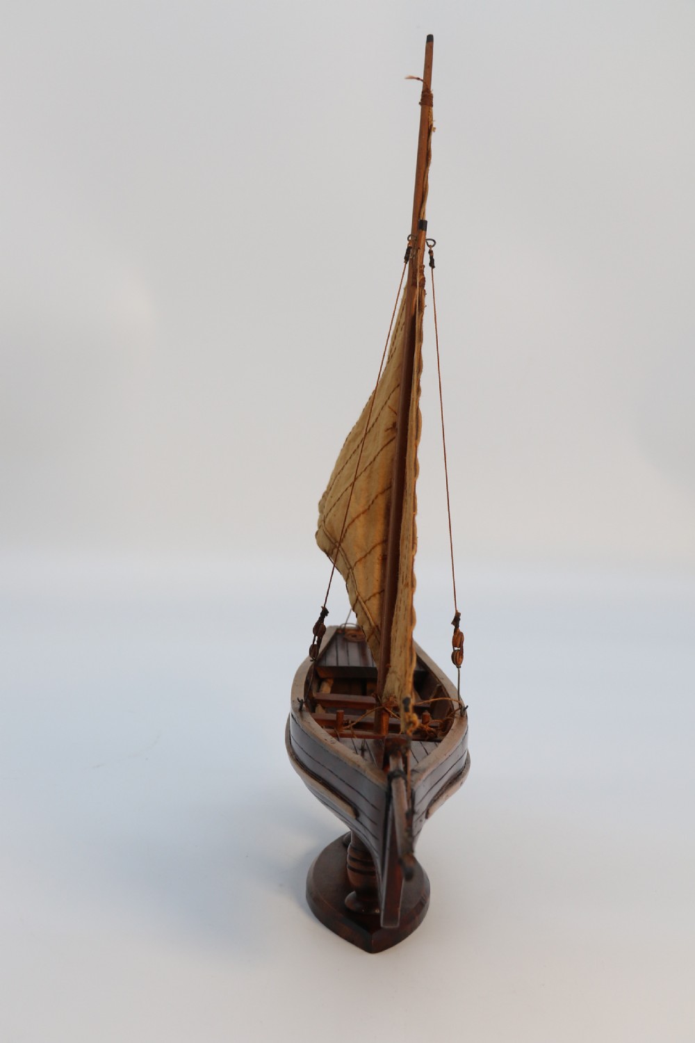 An English handmade yew wood model of an elegant 19th century sailing boat. View VII