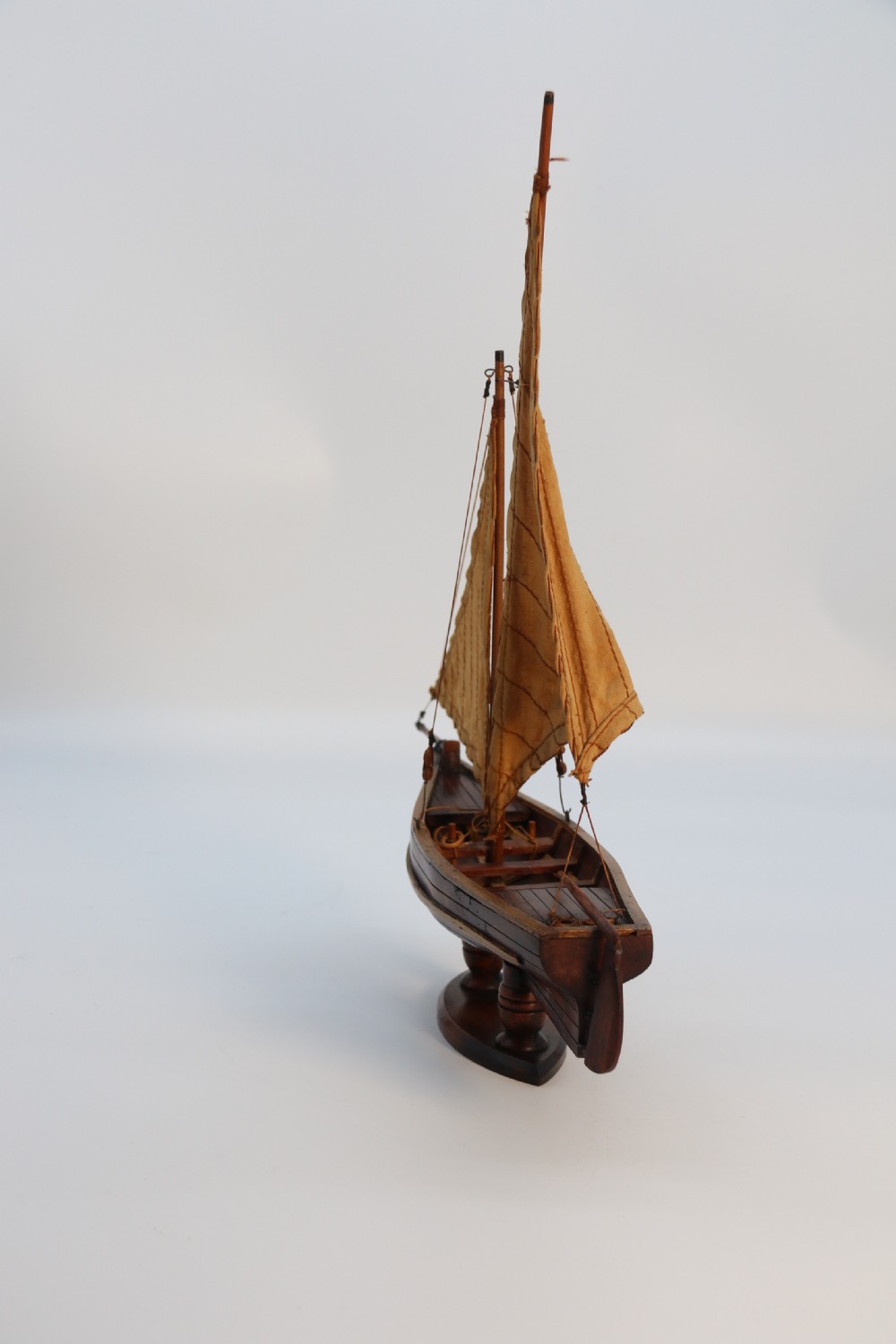 An English handmade yew wood model of an elegant 19th century sailing boat. View VIII