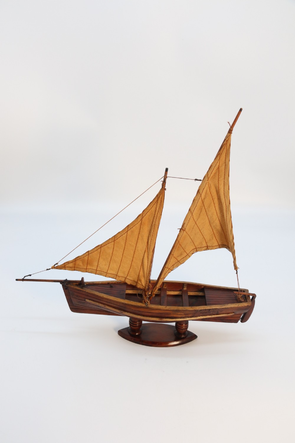 An English handmade yew wood model of an elegant 19th century sailing boat. View IX