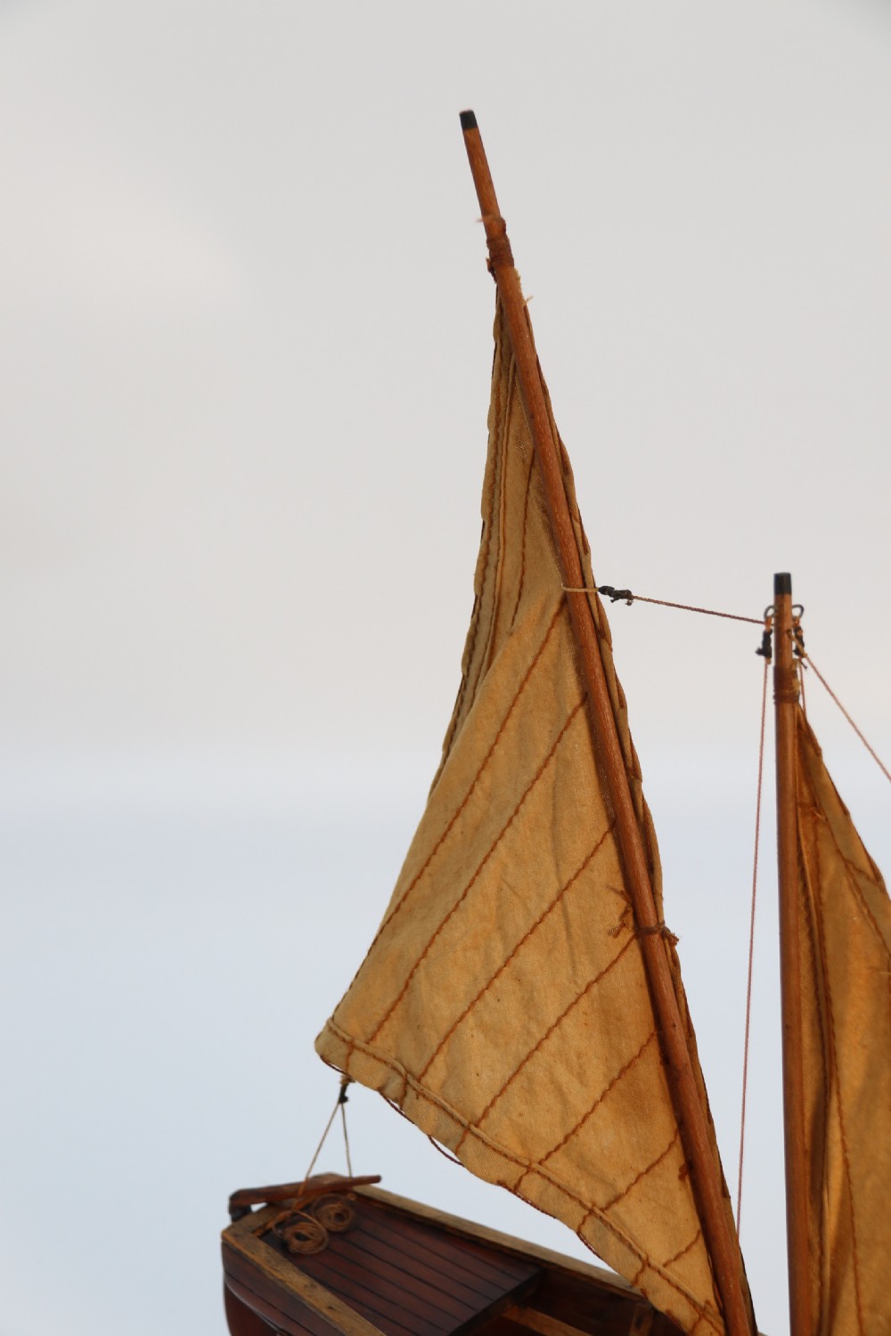 An English handmade yew wood model of an elegant 19th century sailing boat. View XII
