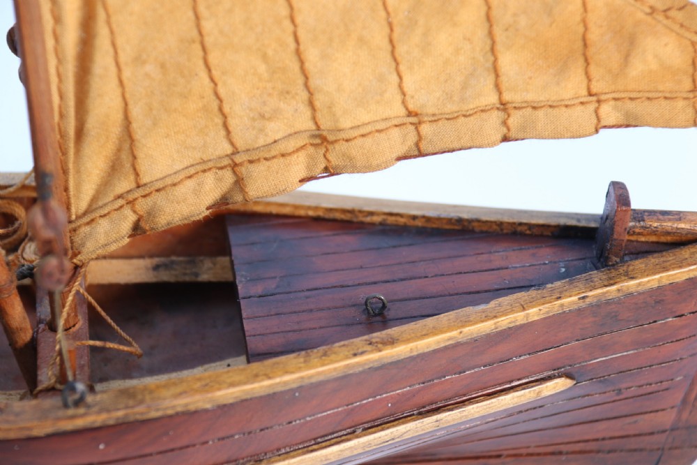 An English handmade yew wood model of an elegant 19th century sailing boat. View XV