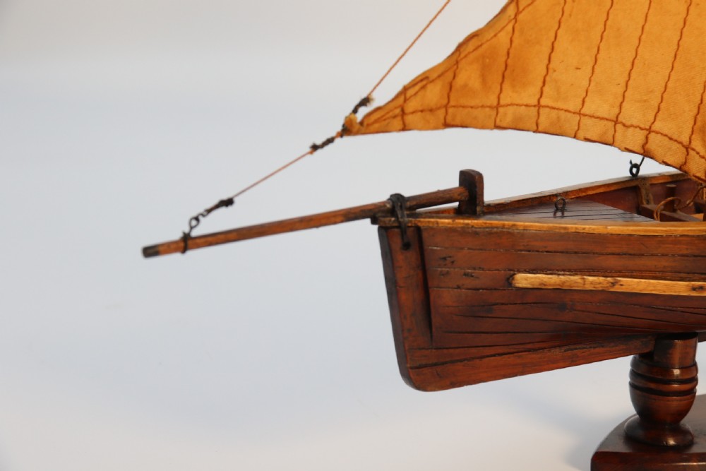 An English handmade yew wood model of an elegant 19th century sailing boat. View XIX