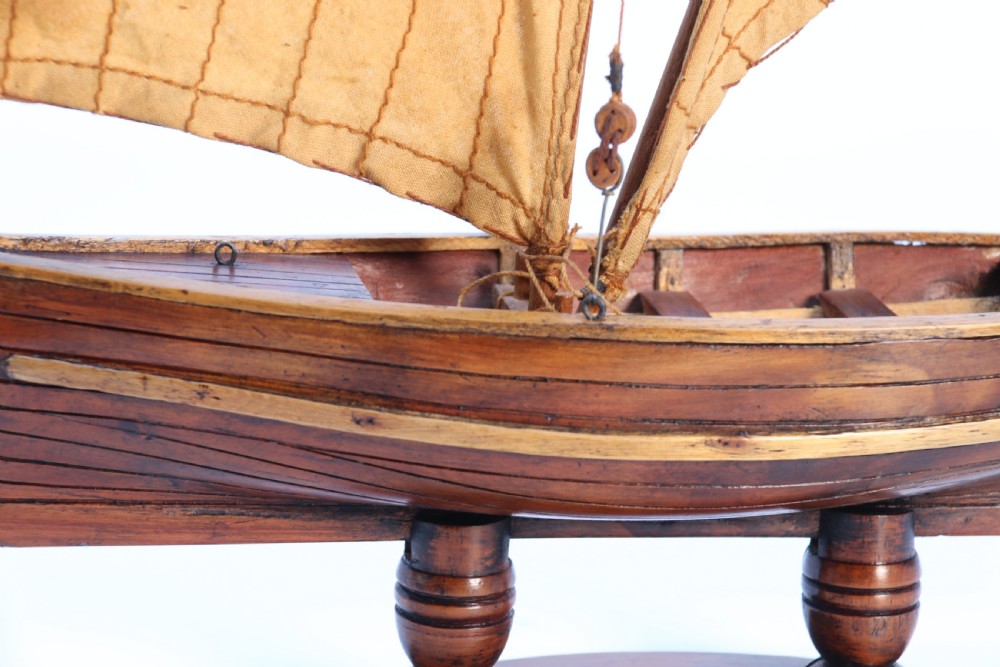 An English handmade yew wood model of an elegant 19th century sailing boat. View XX