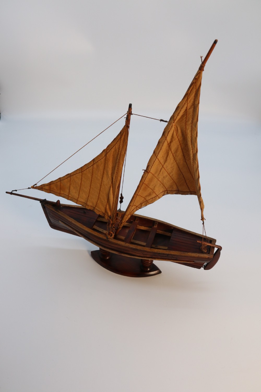 An English handmade yew wood model of an elegant 19th century sailing boat. View XXII