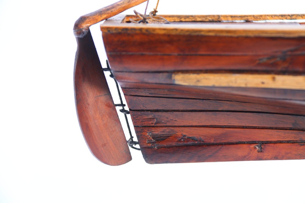 An English handmade yew wood model of an elegant 19th century sailing boat. View XXIII