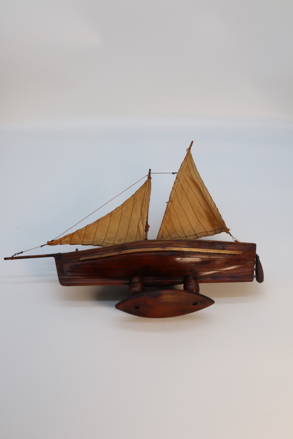 An English handmade yew wood model of an elegant 19th century sailing boat. View XXIV