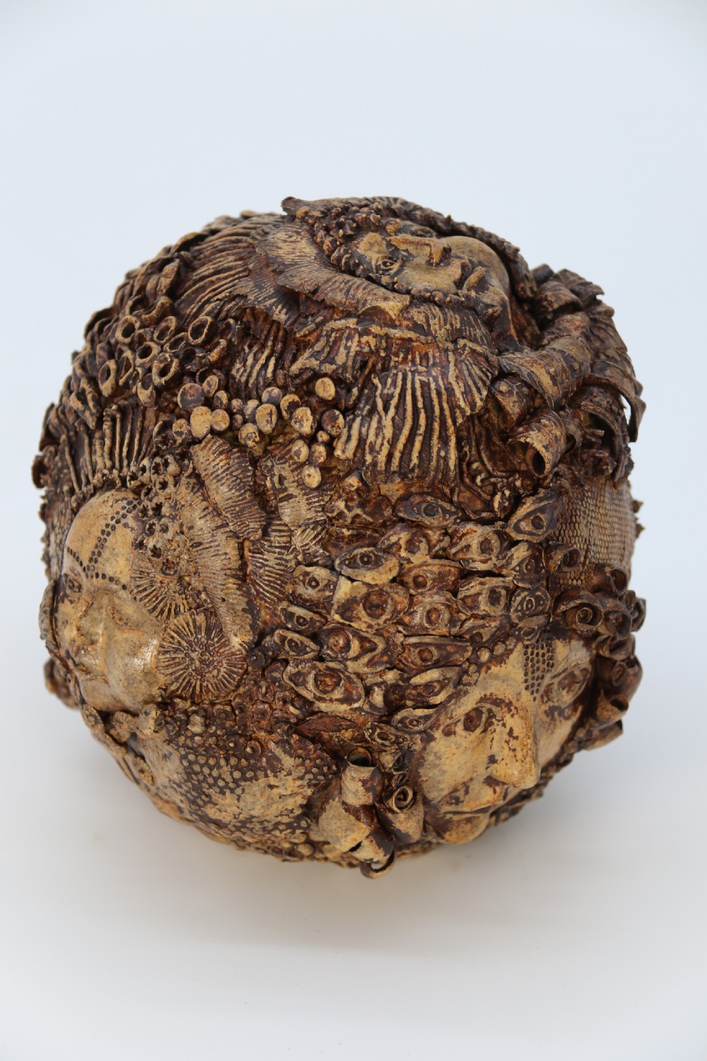 A rare studio pottery hand created mythical sculpture of the many faces of sea urchins.
