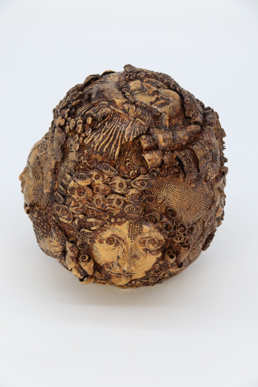 A rare studio pottery hand created mythical sculpture of the many faces of sea urchins. View II