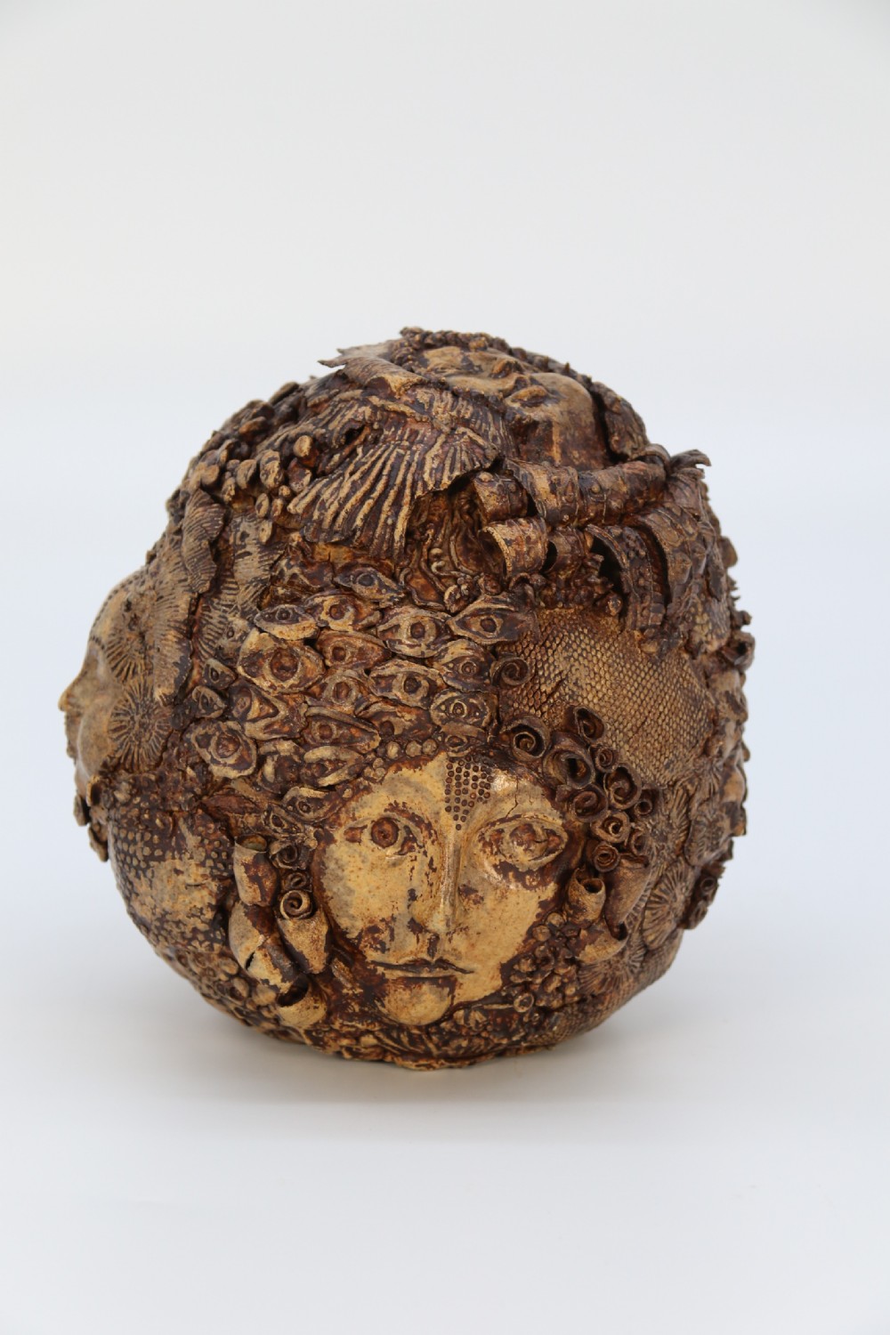 A rare studio pottery hand created mythical sculpture of the many faces of sea urchins. View III
