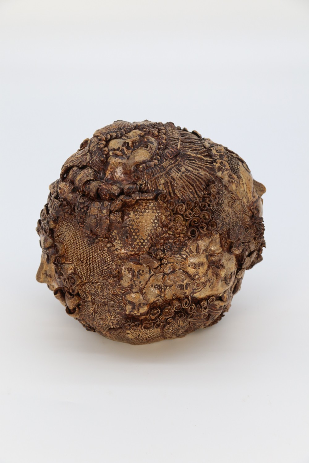 A rare studio pottery hand created mythical sculpture of the many faces of sea urchins. View IV