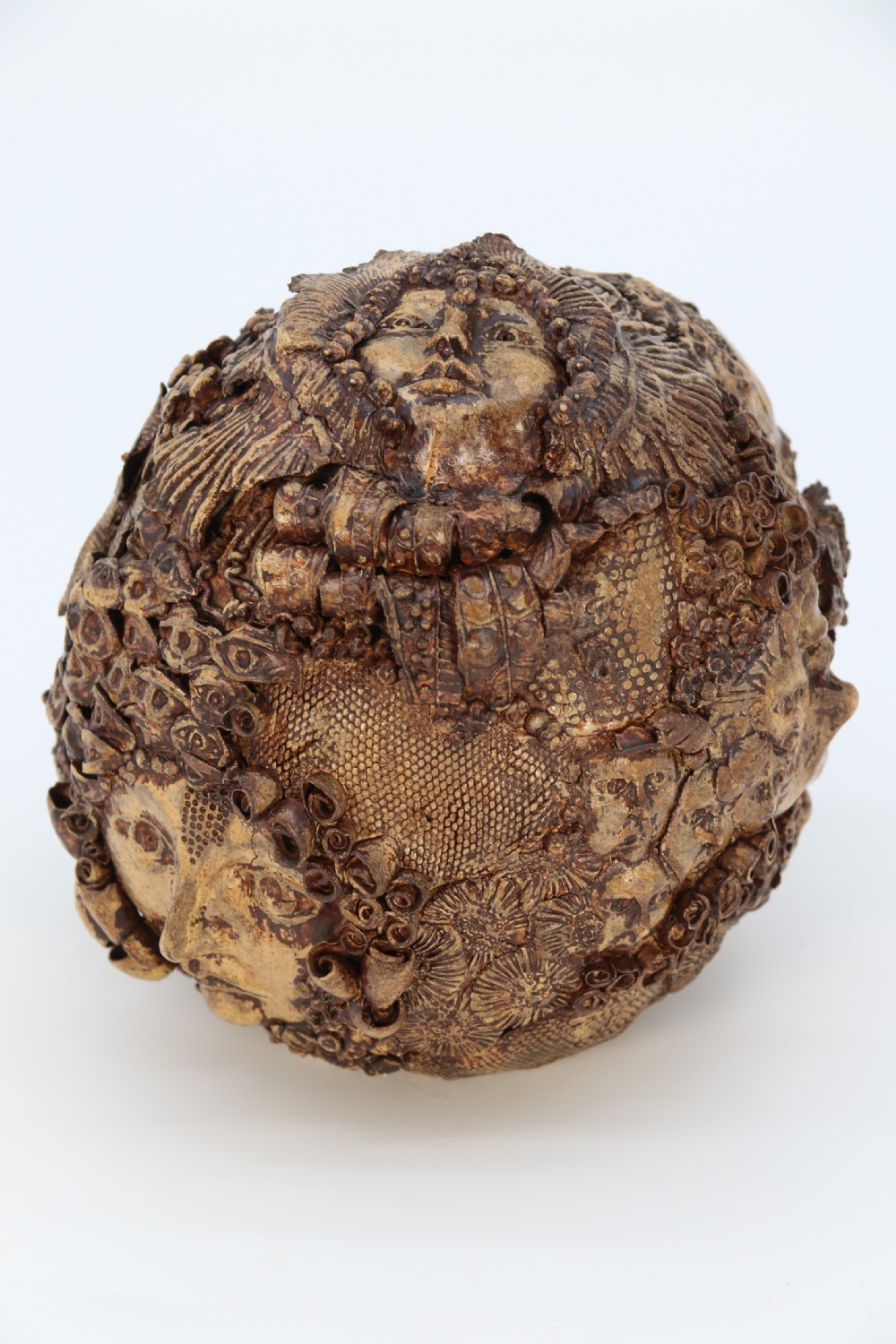 A rare studio pottery hand created mythical sculpture of the many faces of sea urchins. View V