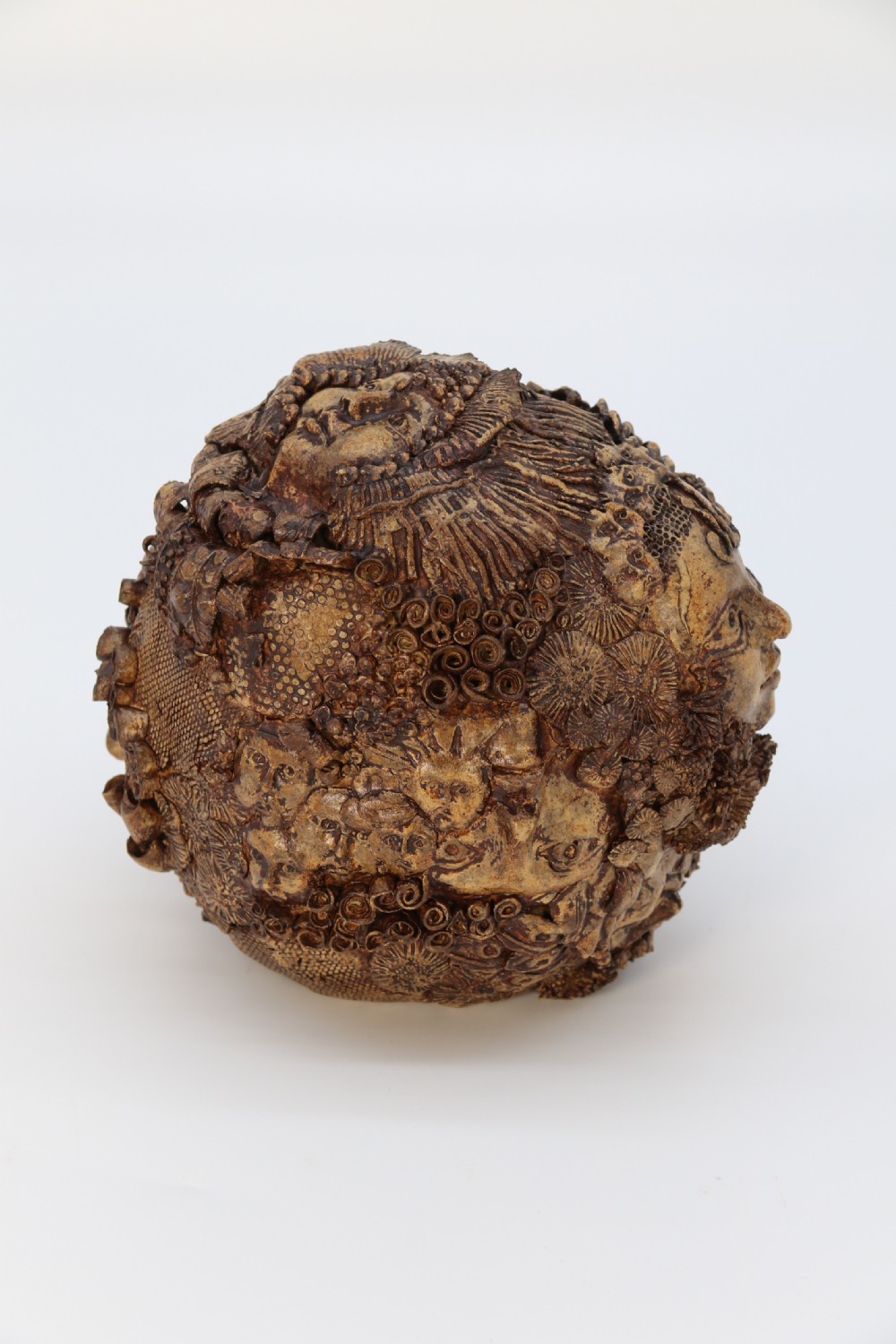 A rare studio pottery hand created mythical sculpture of the many faces of sea urchins. View VI