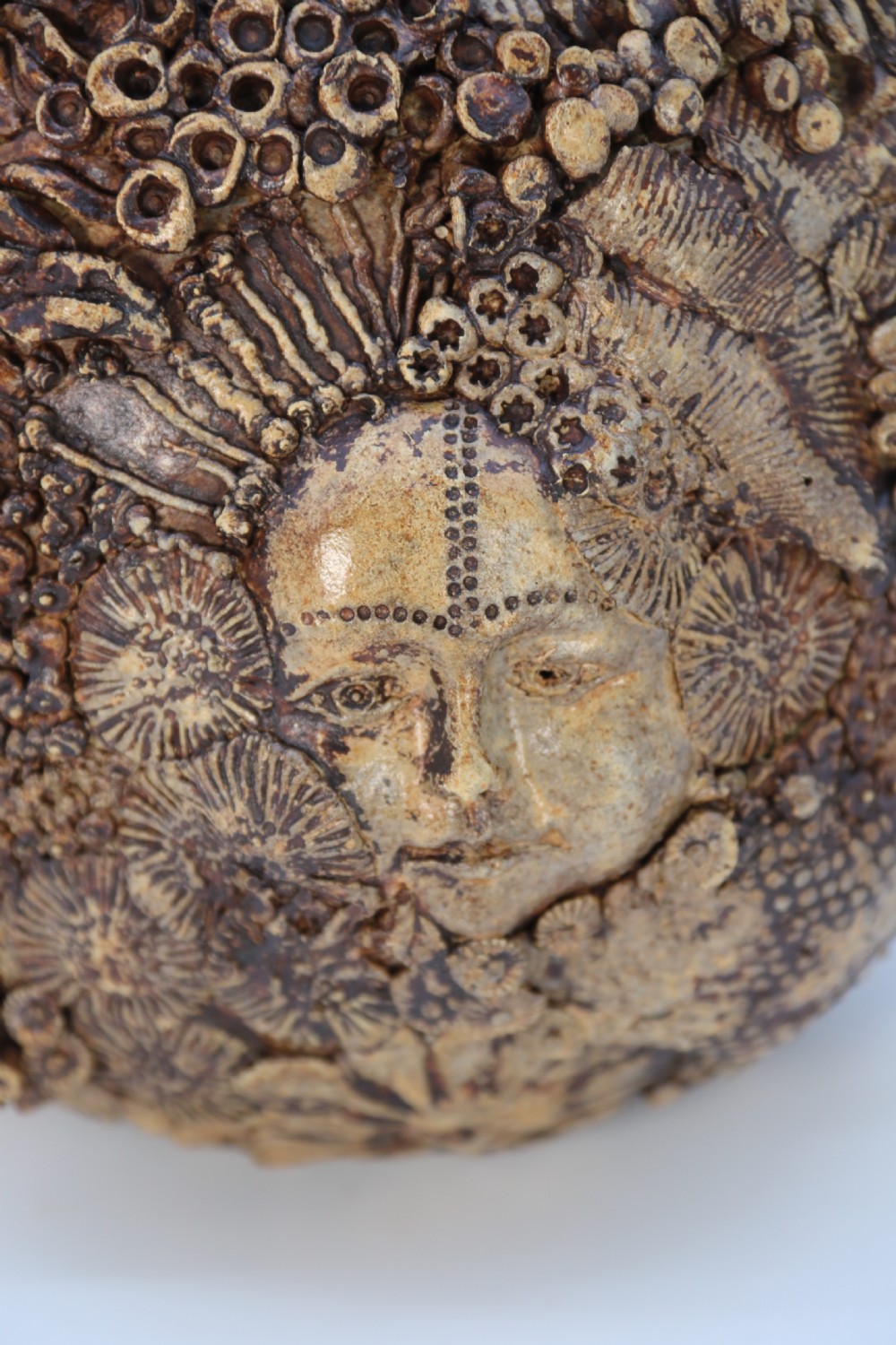 A rare studio pottery hand created mythical sculpture of the many faces of sea urchins. View X