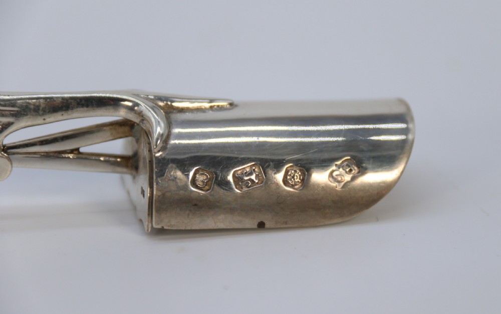 A Georgian style stilton cheese scoop finely made in heavy hall marked silver

 View IX
