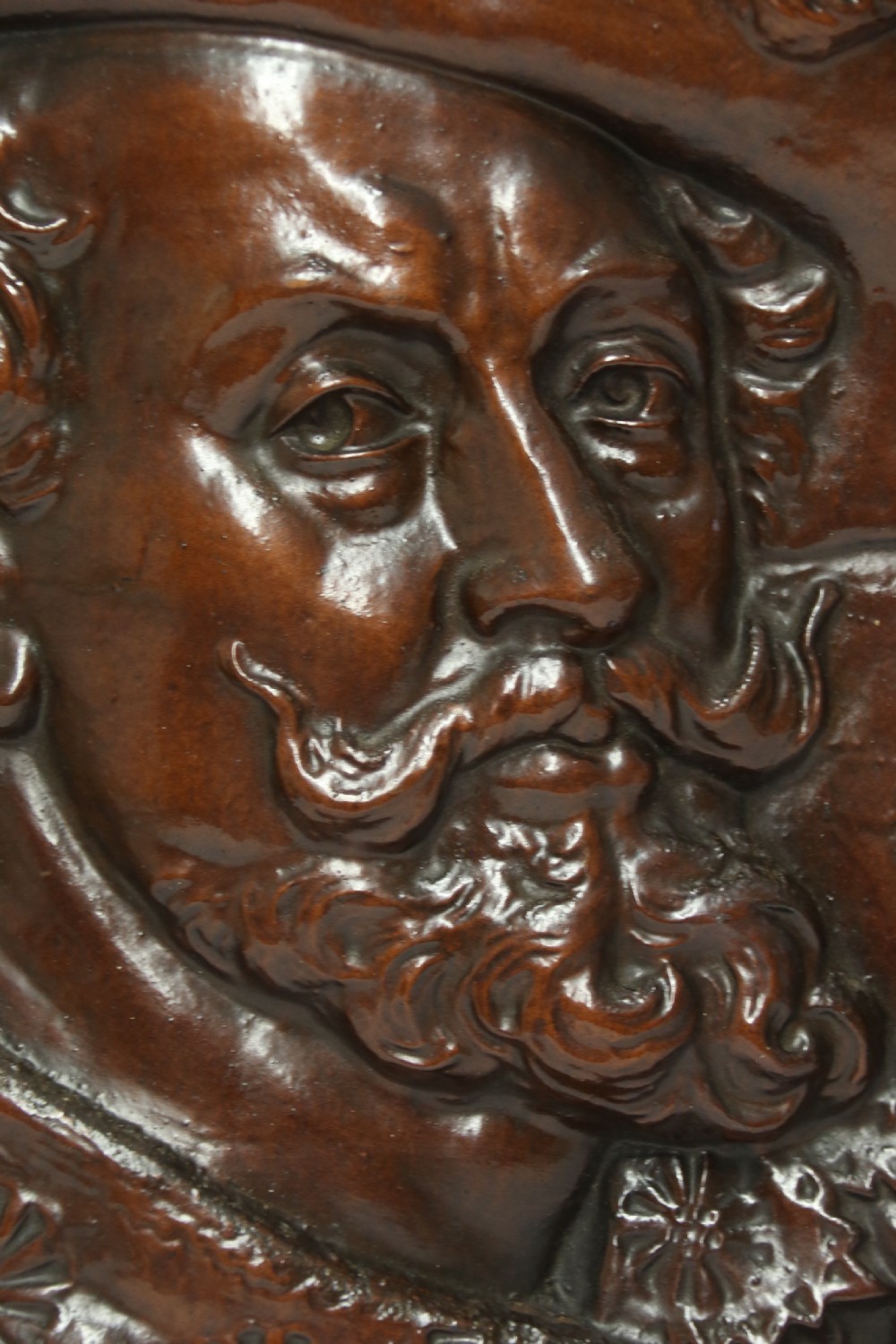 A matched pair of circular dark brown cast iron relief plaques featuring high-relief portrait busts of Peter Paul Rubens and William Shakespeare. View VI