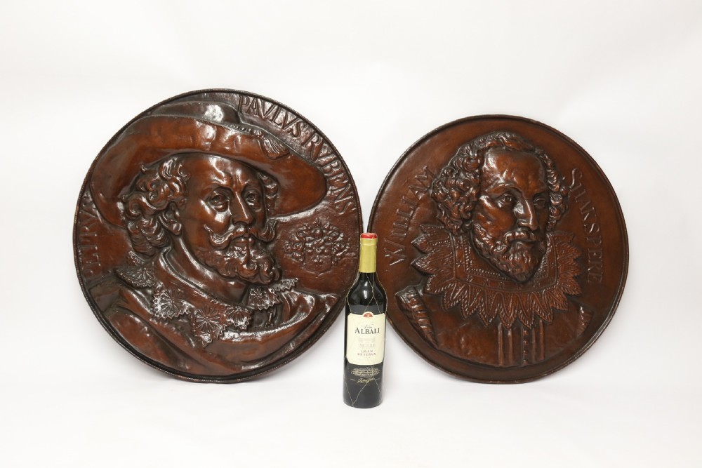 A matched pair of circular dark brown cast iron relief plaques featuring high-relief portrait busts of Peter Paul Rubens and William Shakespeare. View VII