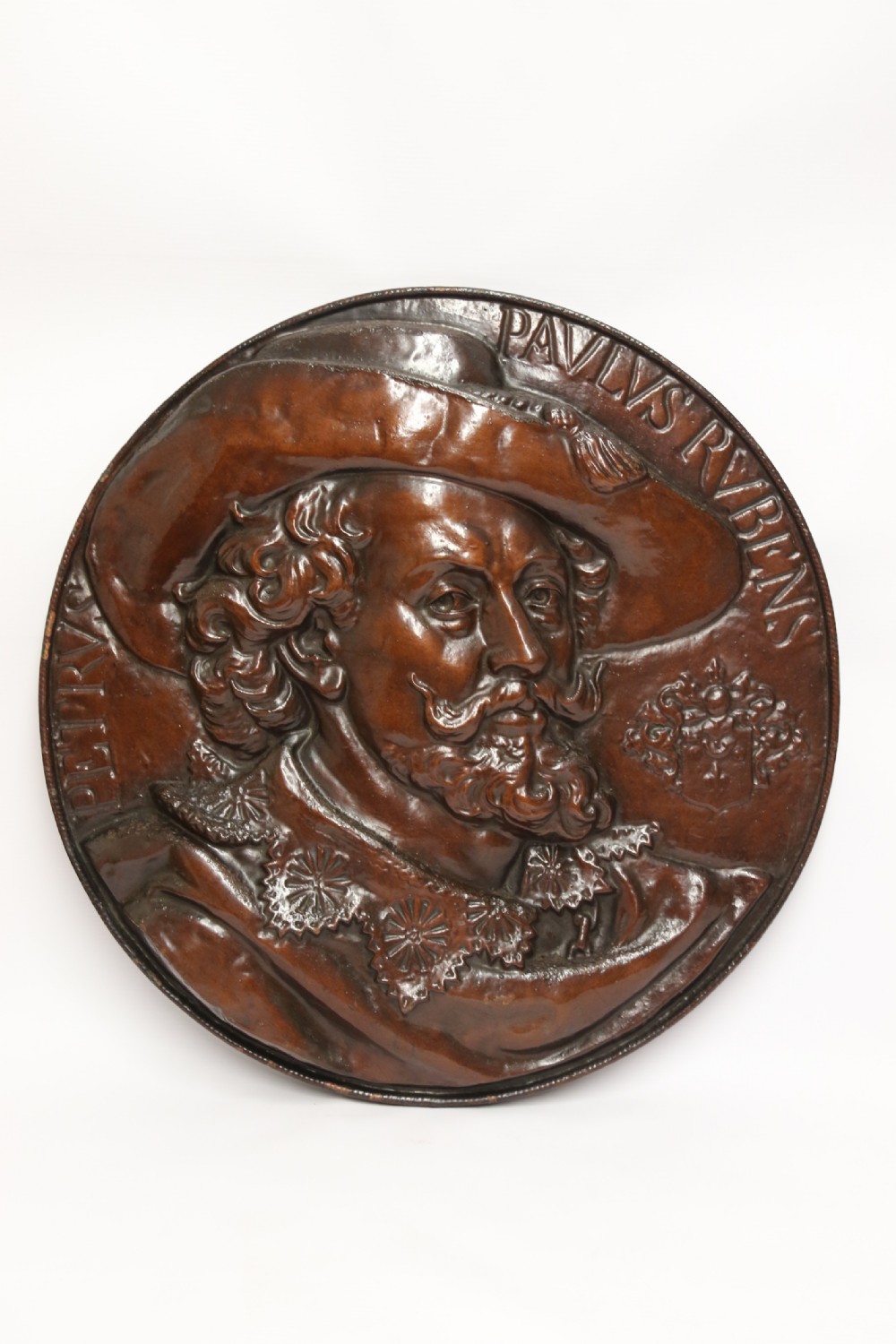 A matched pair of circular dark brown cast iron relief plaques featuring high-relief portrait busts of Peter Paul Rubens and William Shakespeare. View IX