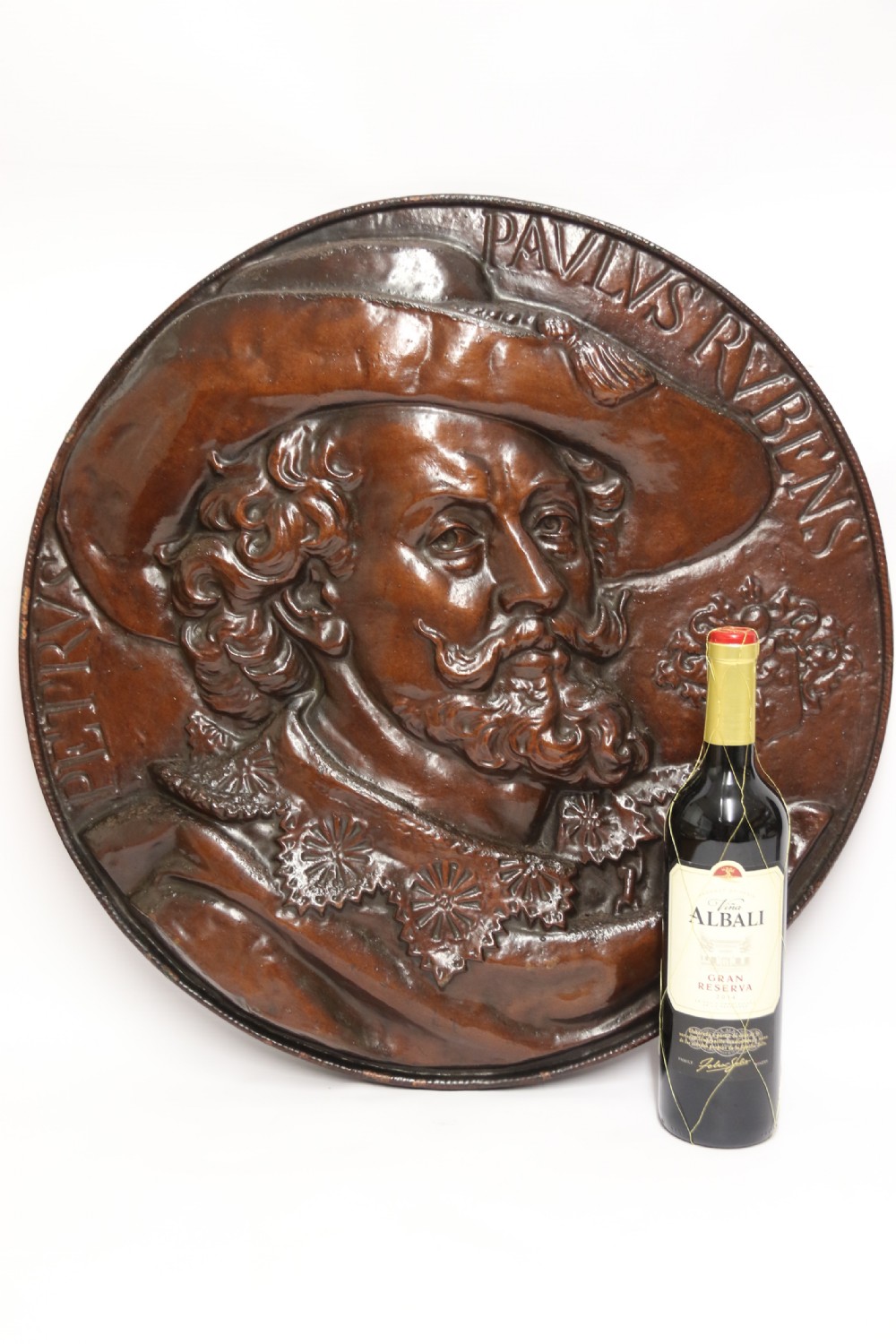 A matched pair of circular dark brown cast iron relief plaques featuring high-relief portrait busts of Peter Paul Rubens and William Shakespeare. View XII