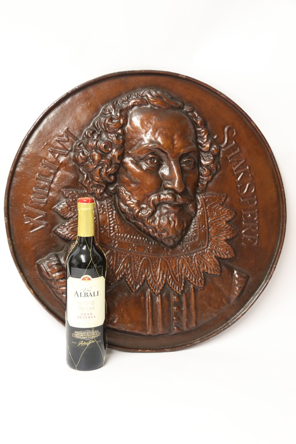 A matched pair of circular dark brown cast iron relief plaques featuring high-relief portrait busts of Peter Paul Rubens and William Shakespeare. View XIII