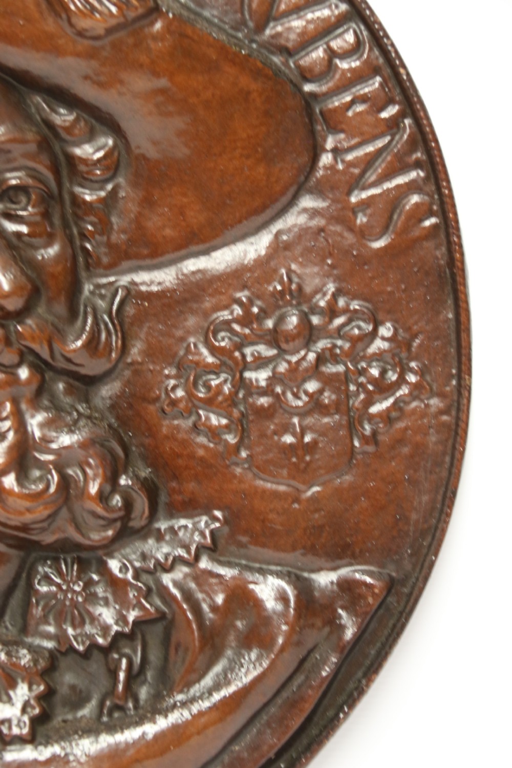 A matched pair of circular dark brown cast iron relief plaques featuring high-relief portrait busts of Peter Paul Rubens and William Shakespeare. View XIV