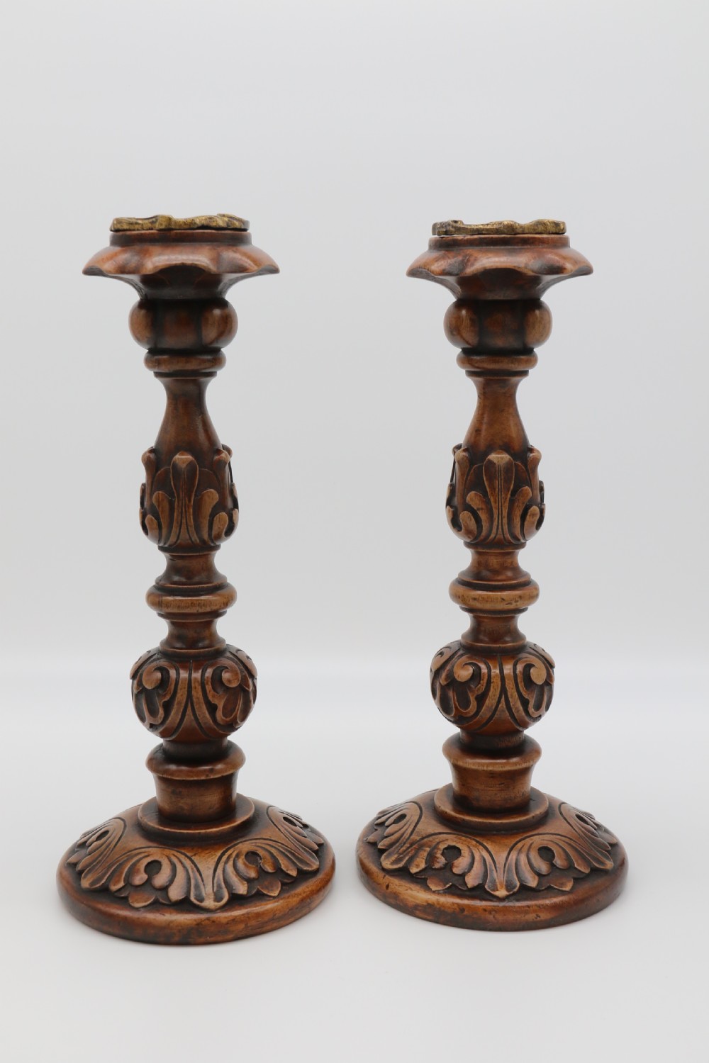 A large scale pair of English 19th century carved walnut and brass mounted candlesticks View II