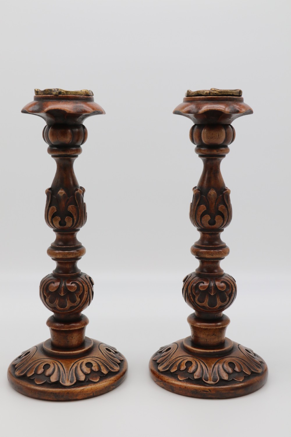 A large scale pair of English 19th century carved walnut and brass mounted candlesticks View III