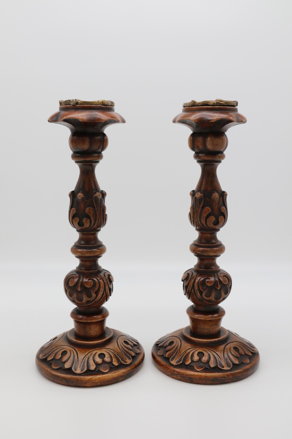 A large scale pair of English 19th century carved walnut and brass mounted candlesticks View IV