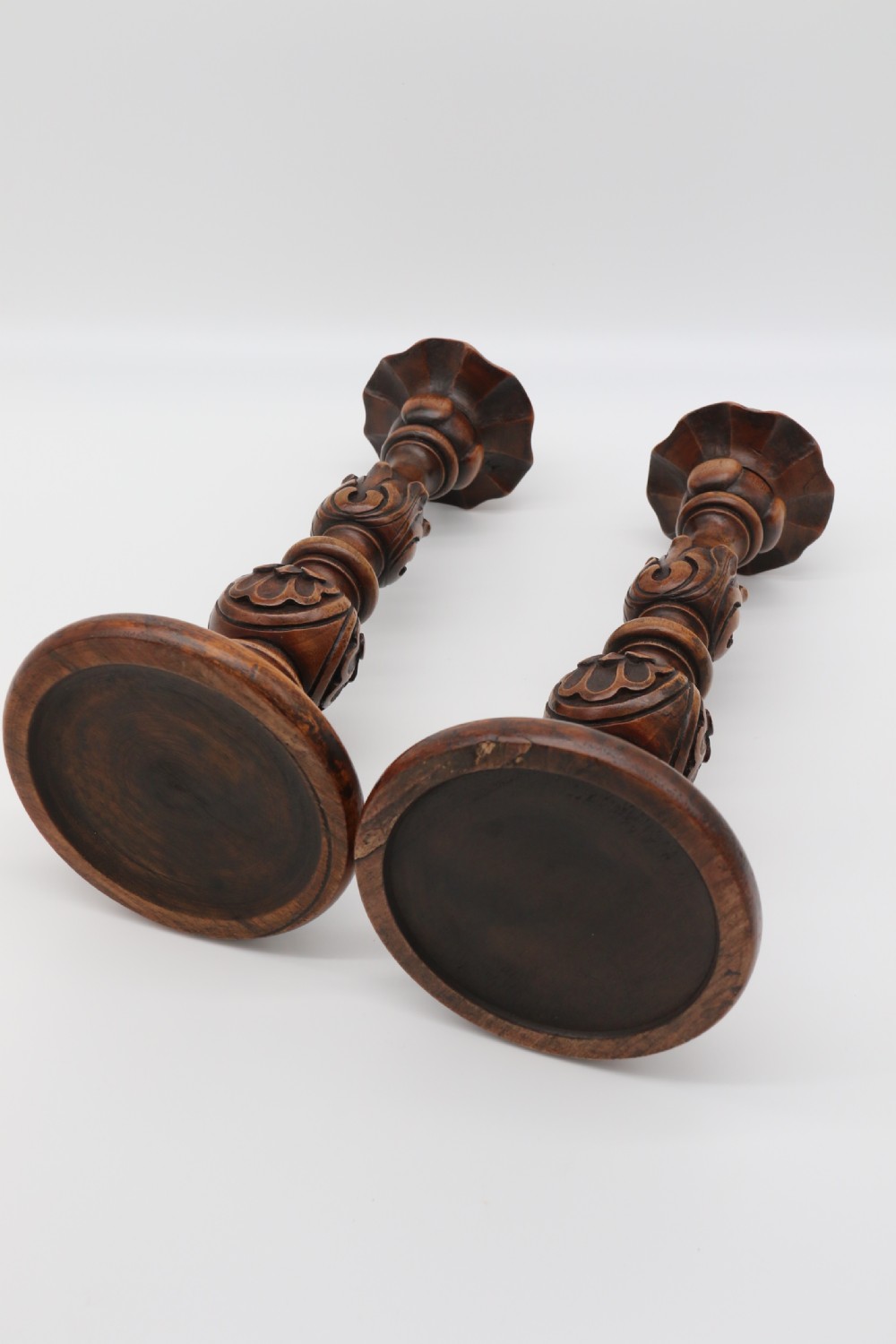 A large scale pair of English 19th century carved walnut and brass mounted candlesticks View VII