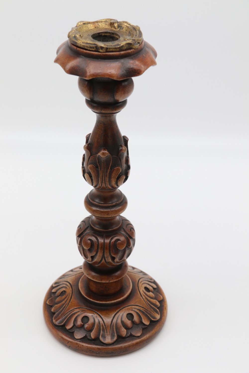 A large scale pair of English 19th century carved walnut and brass mounted candlesticks View VIII