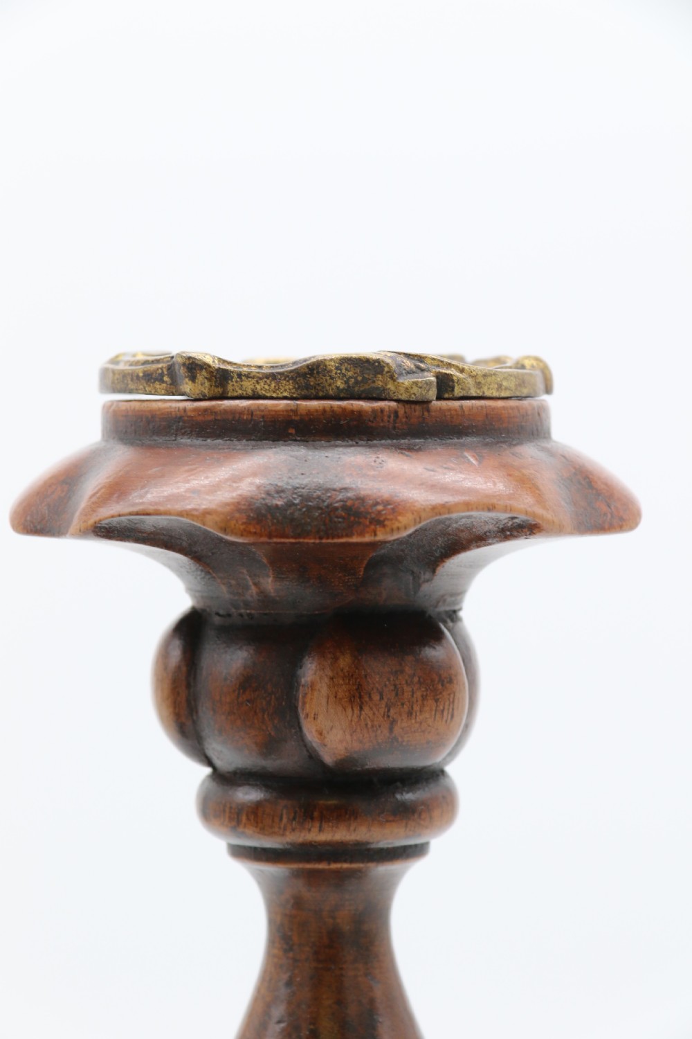 A large scale pair of English 19th century carved walnut and brass mounted candlesticks View IX