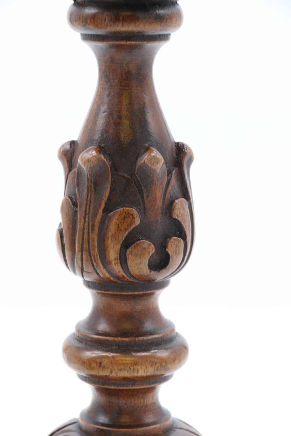 A large scale pair of English 19th century carved walnut and brass mounted candlesticks View X