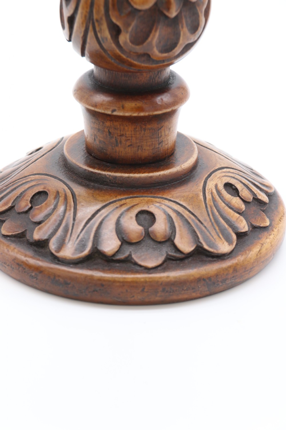 A large scale pair of English 19th century carved walnut and brass mounted candlesticks View XII