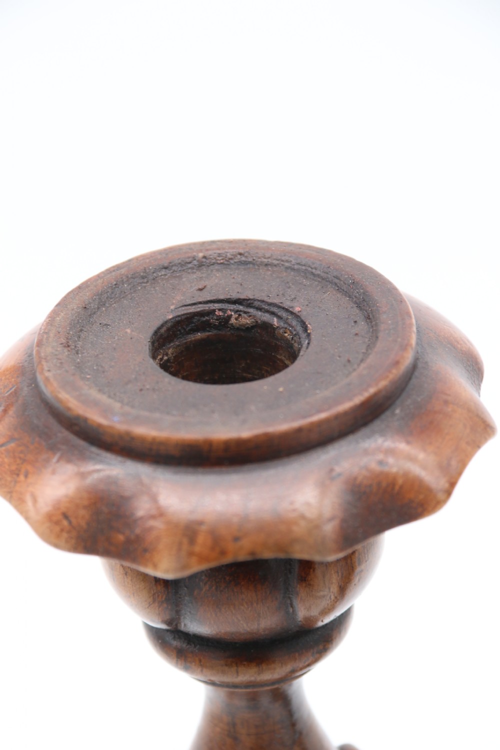 A large scale pair of English 19th century carved walnut and brass mounted candlesticks View XV