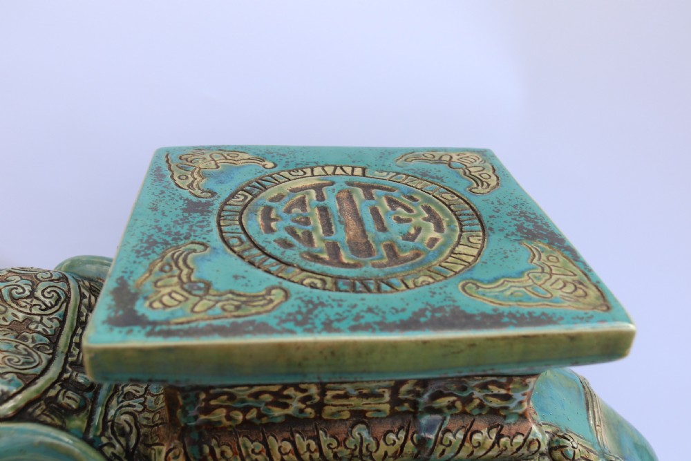A large Chinese turquoise green pottery elephant display pedestal/stand. View II