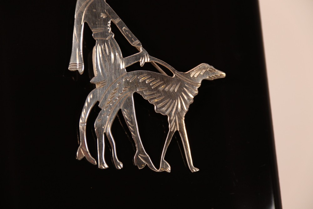 An Art Deco silver brooch  in the form of an elegant 1920s lady walking her borzoi dog. View IV