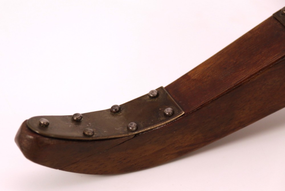 A detailed hand-built scale model of a 17th-century field cannon featuring a patinated brass barrel mounted on a dark timber carriage with spoked wheels. View XVII