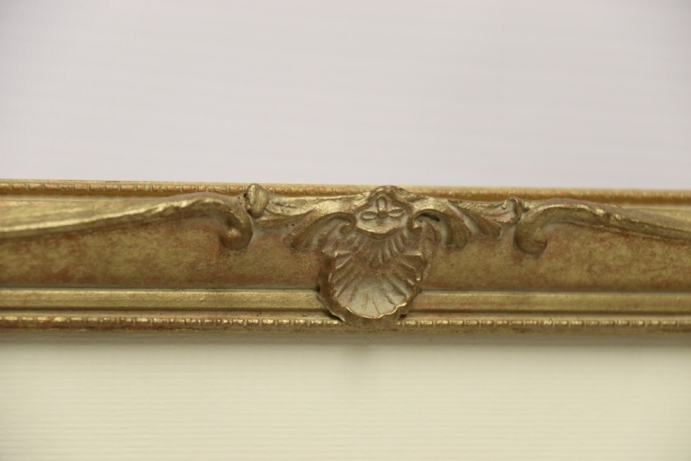 A framed 1920s watercolour landscape painting showing a stone building with vine foliage, set inside a decorative gilt frame with cream matting. View V