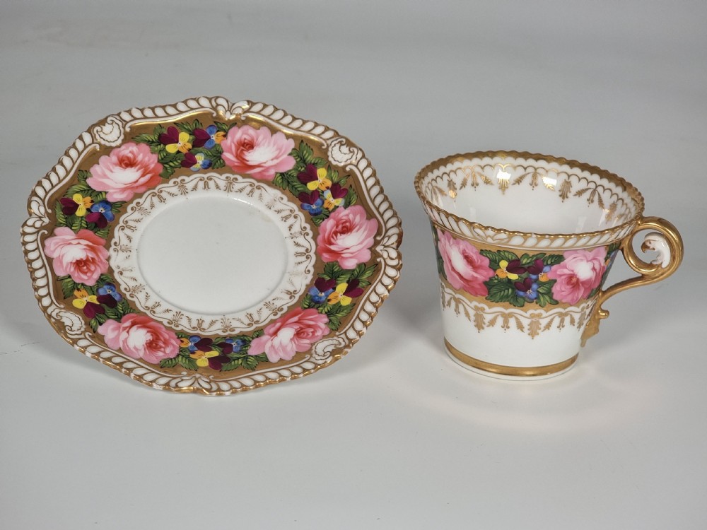 A rare Chamberlains Worcester cabinet cup and saucer hand painted with roses and pansies, circa 1816

 View II