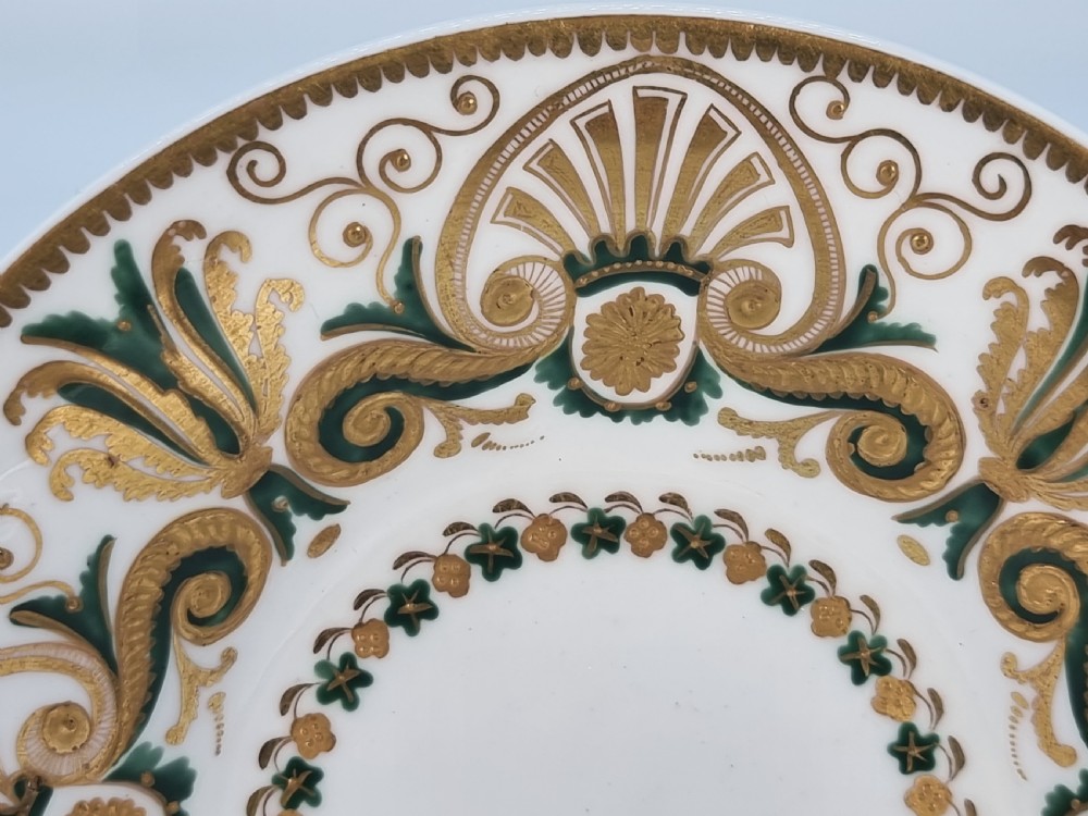 An early 19th-century Spode porcelain cabinet trio consisting of a teacup, coffee cup, and saucer adorned with intricate gold gilding and green scrollwork. View III