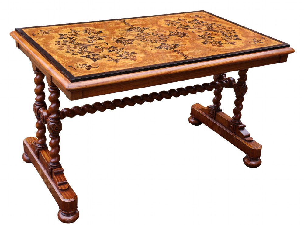 A rectangular mid-19th century satinwood centre table featuring detailed floral marquetry inlay across the tabletop, supported by carved barley twist legs and a central stretcher.