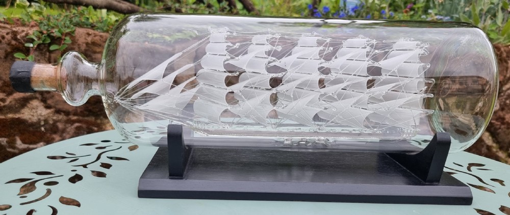 An exceptionally large hand blown glass model ship in a bottle. View II