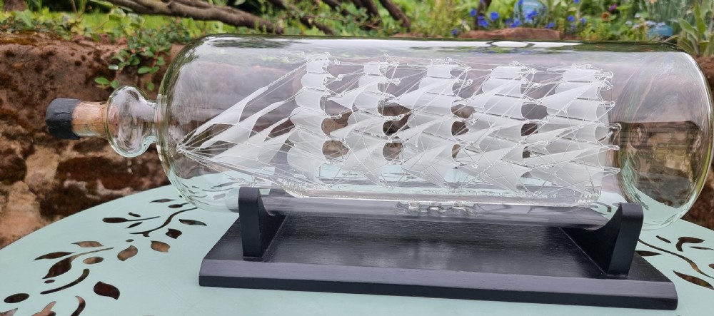 An exceptionally large hand blown glass model ship in a bottle. View IV