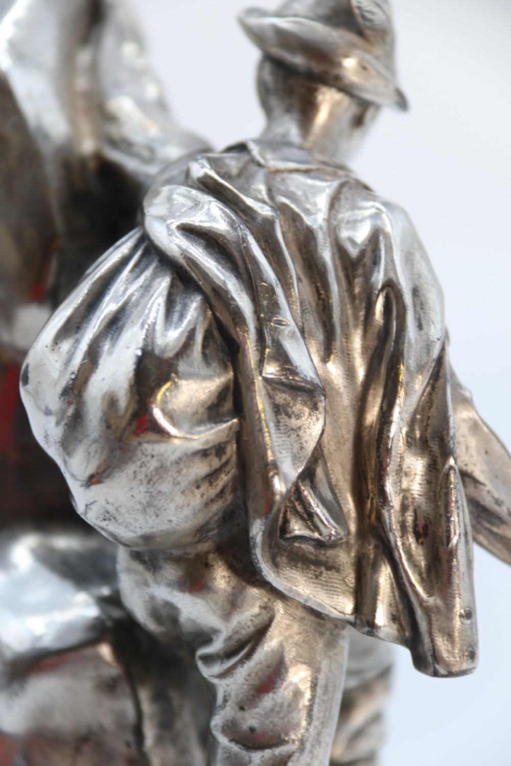 A  WMF cast metal and silver plated sculpture of an early 20th century mountaineer climbing a rock face, c 1910


 View XXII